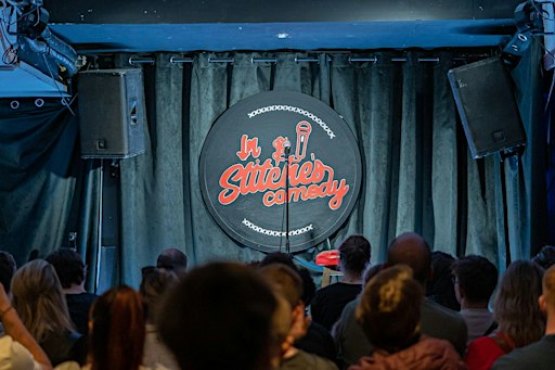 In Stitches Comedy Club Tuesdays at the International bar 8PM